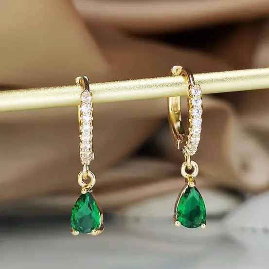 Gold-colored crystal pendant earrings