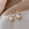 Triangular earrings with elegant pearls
