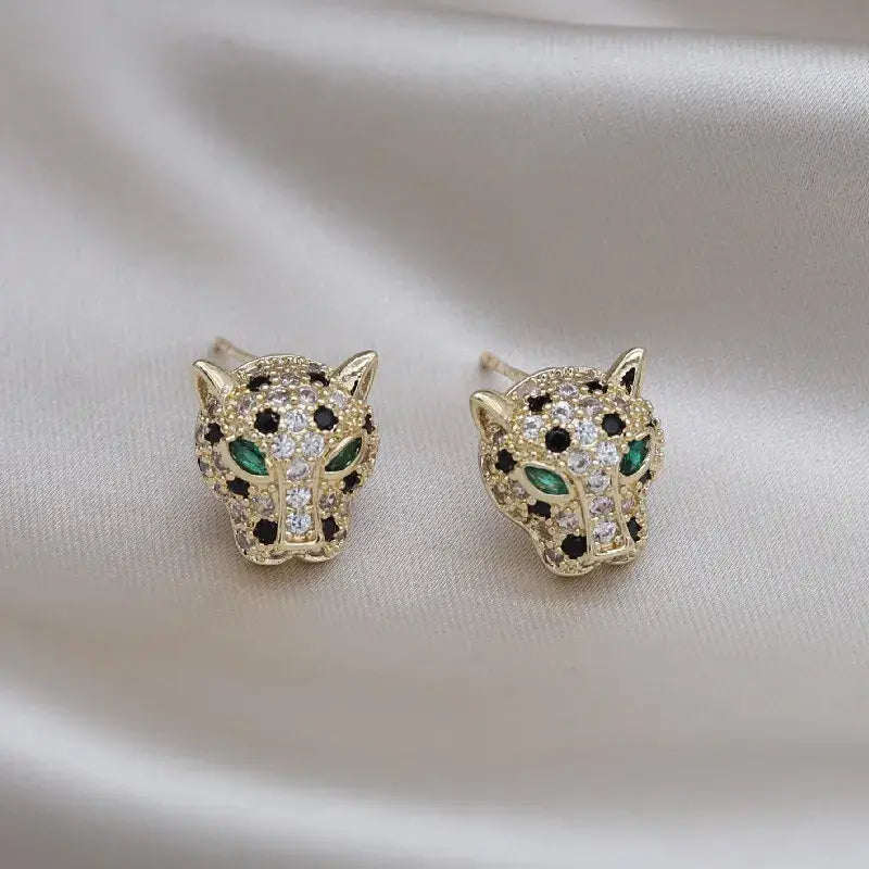 Eleganckie leuchtende Leopardenohrringe
