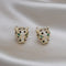 Eleganckie leuchtende Leopardenohrringe