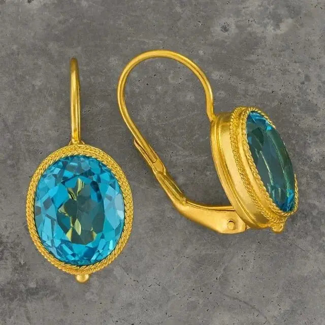 Gold earrings with blue crystals in vintage style