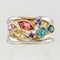 Gold and silver ring with colored zircons
