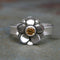 Silver ring with a daisy