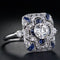 Silver ring with blue zircons