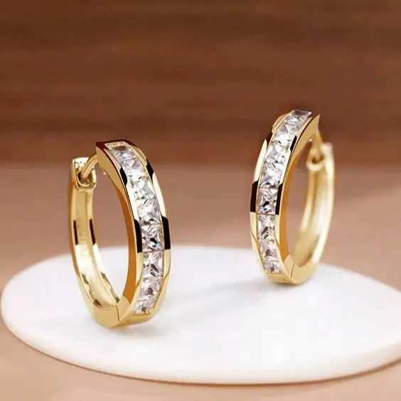 Elegant gold earrings with crystals