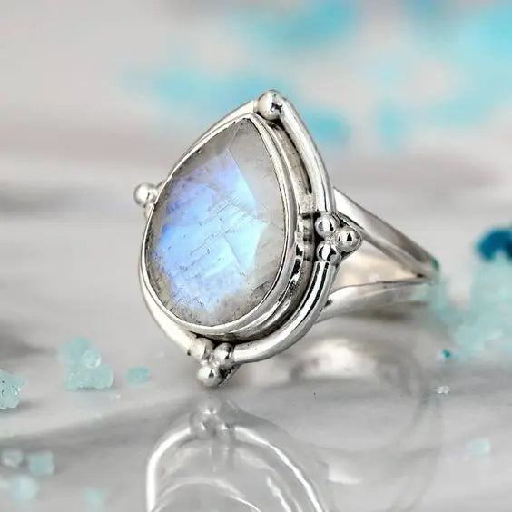 Ring with white opal in vintage style