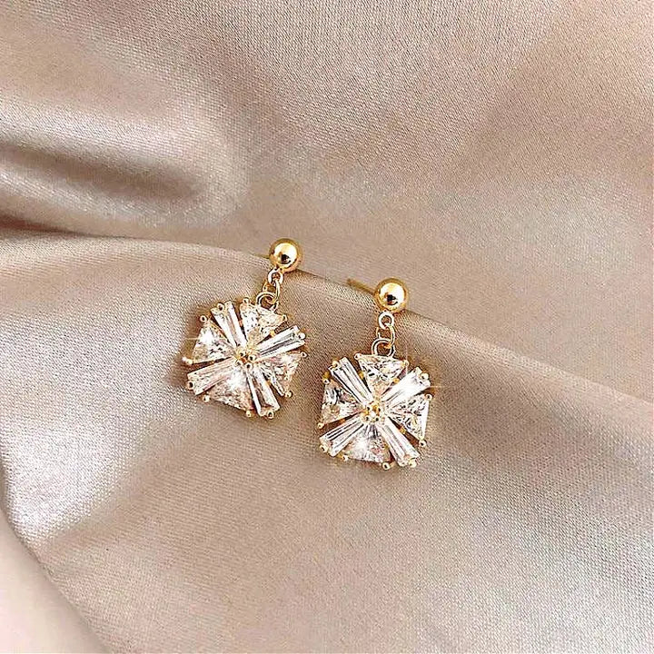 Luxury gold earrings with zircons