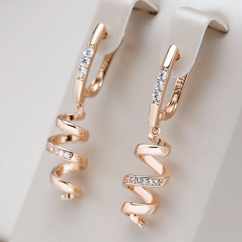 Elegant spiral earrings with zirconia in gold color
