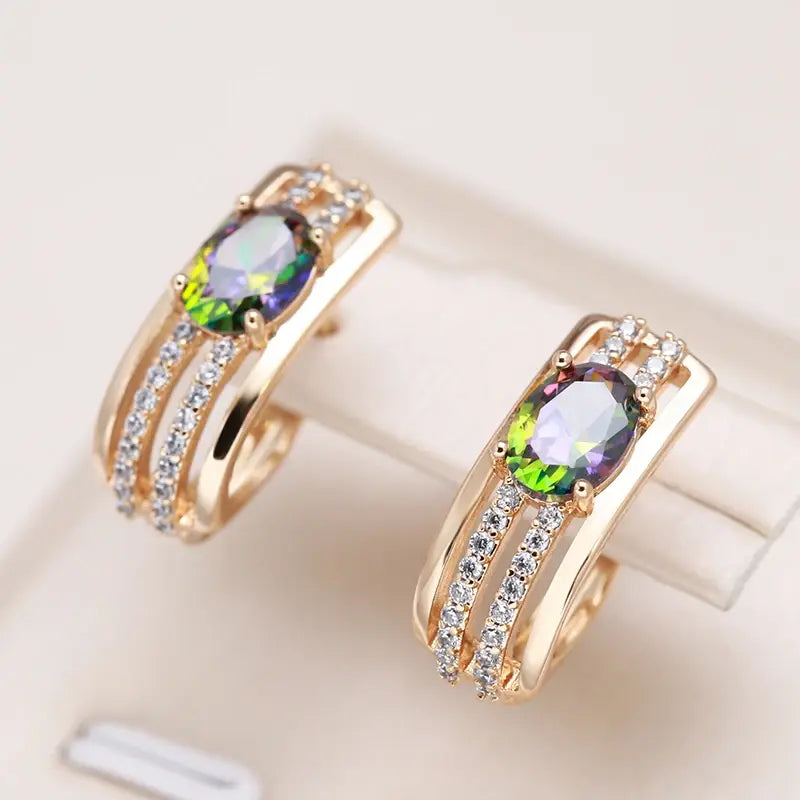 Elegant gold earrings with cubic zirconia and green crystal