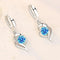 Silver earrings with zircons
